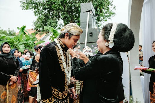 A vibrant outdoor Indonesian wedding ceremony featuring traditional attire and cultural rituals.