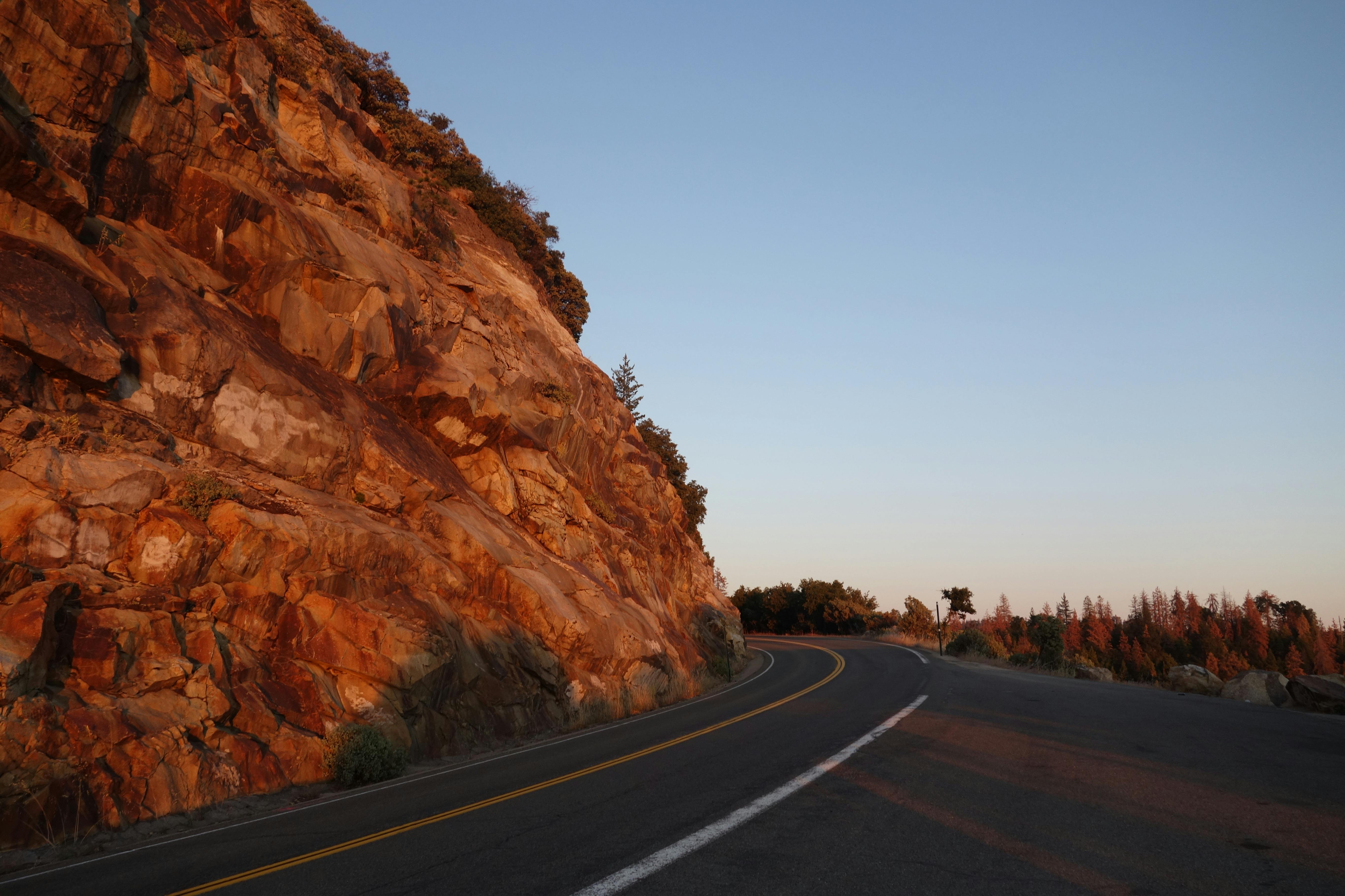 asphalt-road-beside-mountain-free-stock-photo