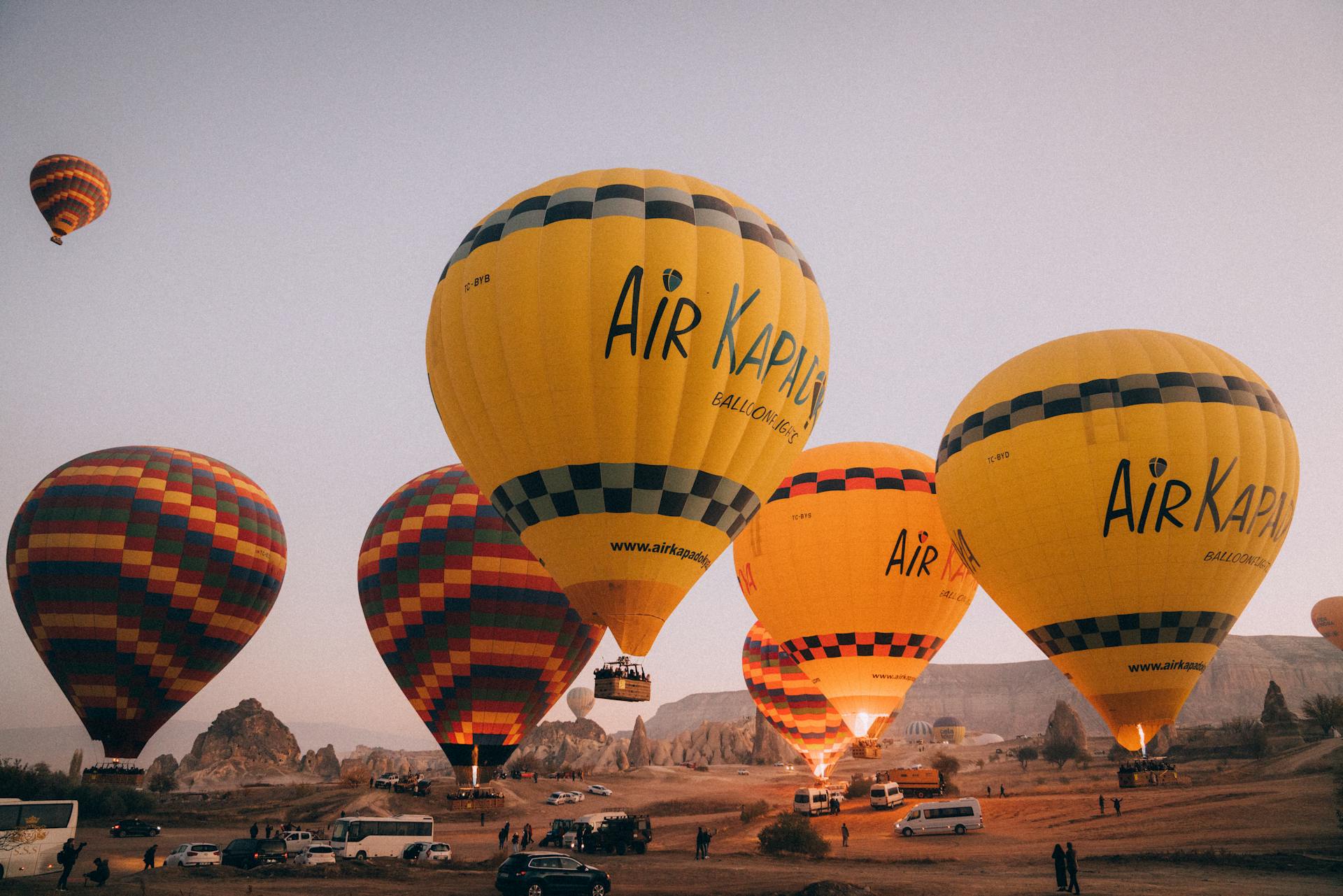 Hot Air Balloons over People and Cars