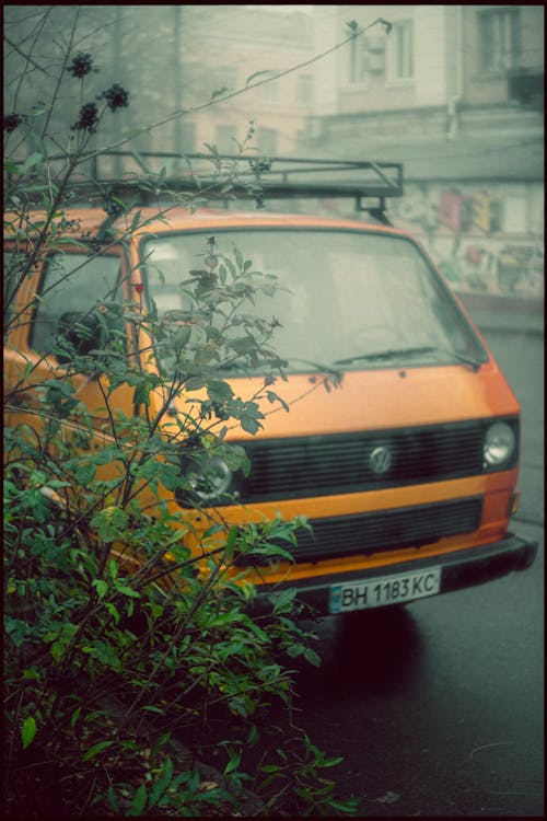 Orange Classic Van Parked on Roadside