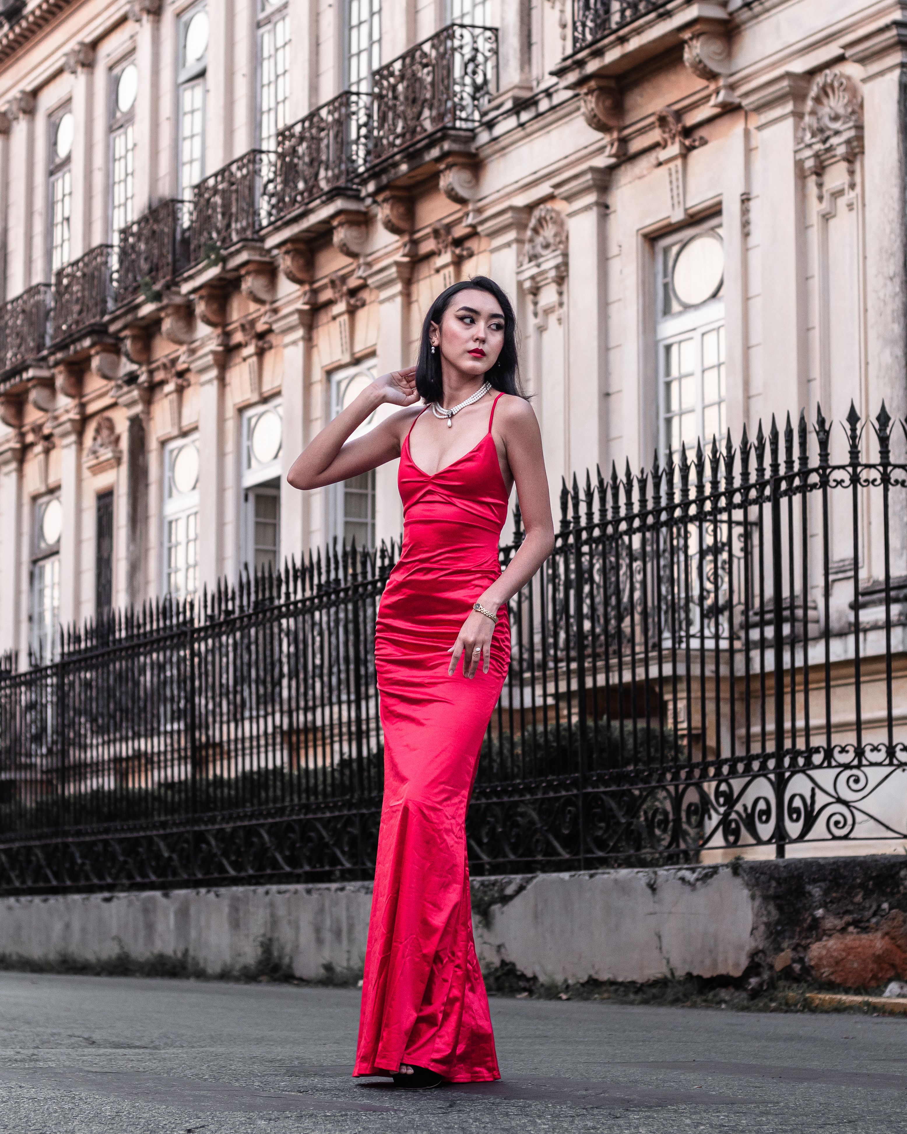 A Woman in Red Dress Standing on the Street · Free Stock Photo