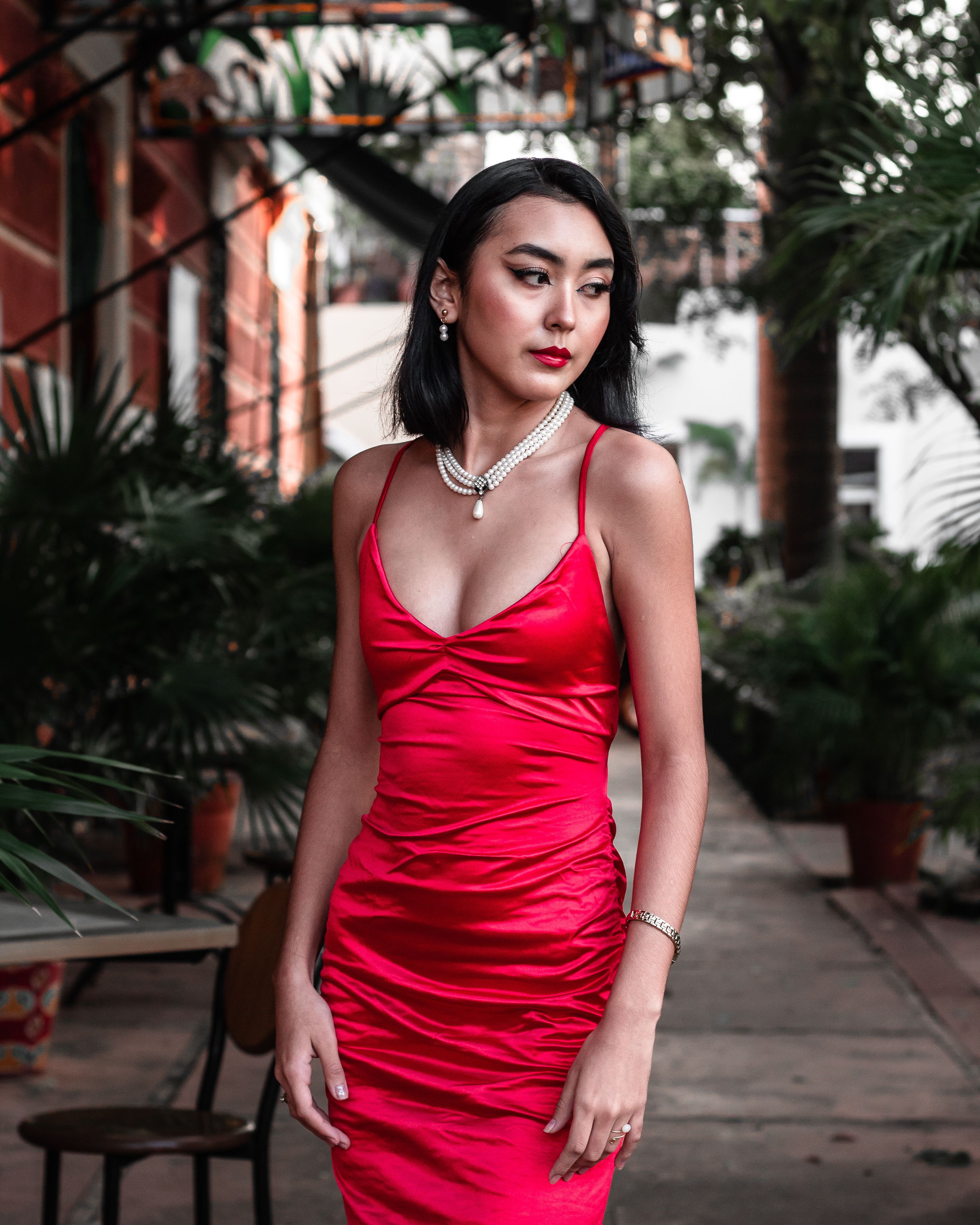 woman in scarlet red satin slip dress