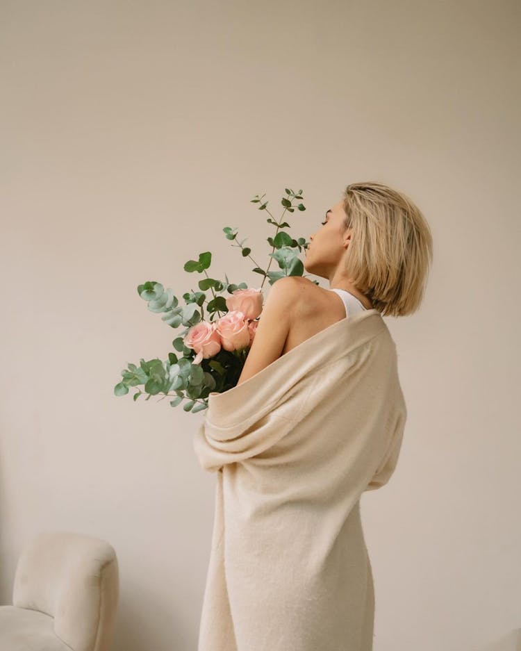 A Woman Holding A Bouquet