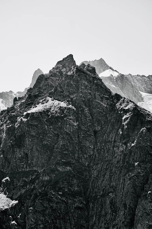 Free Striking image of a rugged snowcapped mountain peak in black and white. Stock Photo