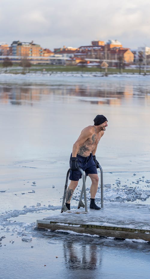Topless Man in Lake in Winter