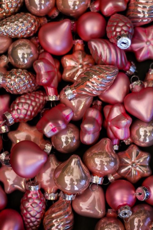 Free A colorful array of festive pink Christmas ornaments for holiday decoration. Stock Photo