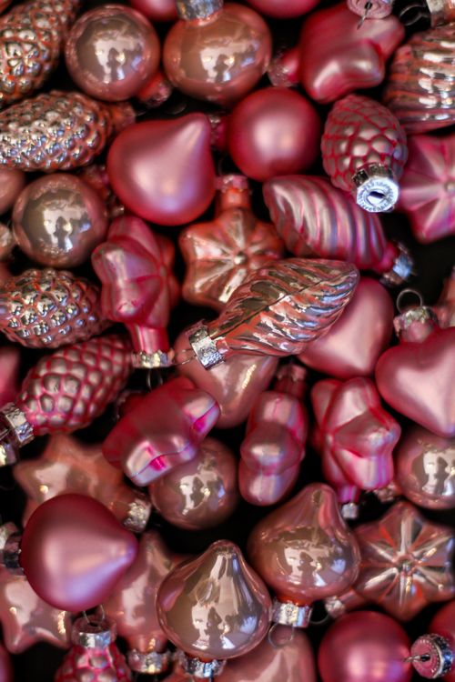 Free Bright pink and silver Christmas ornaments in various shapes. Stock Photo