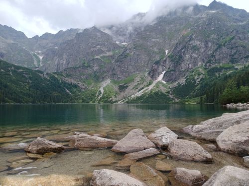 Free Breathtaking landscape of Morskie Oko Lake surrounded by the Tatra Mountains in Poland. Stock Photo