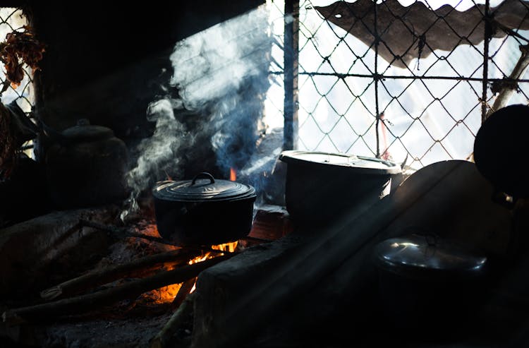 Black Cooking Pot On Fire