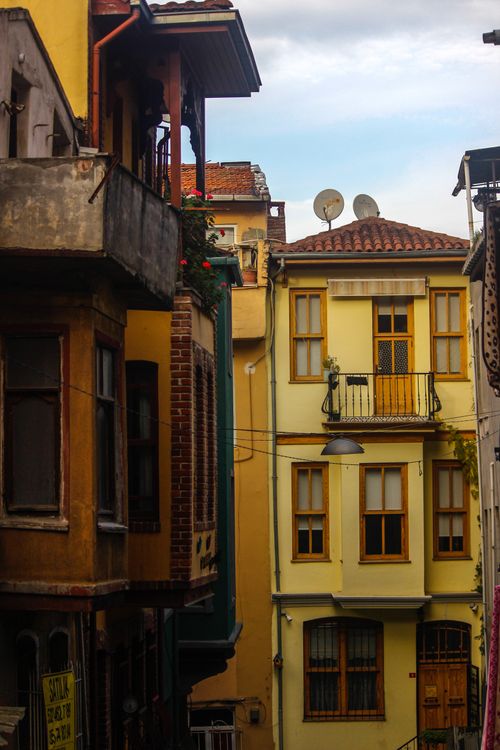 Free Narrow alley in Istanbul featuring colorful historic apartments and balconies. Stock Photo