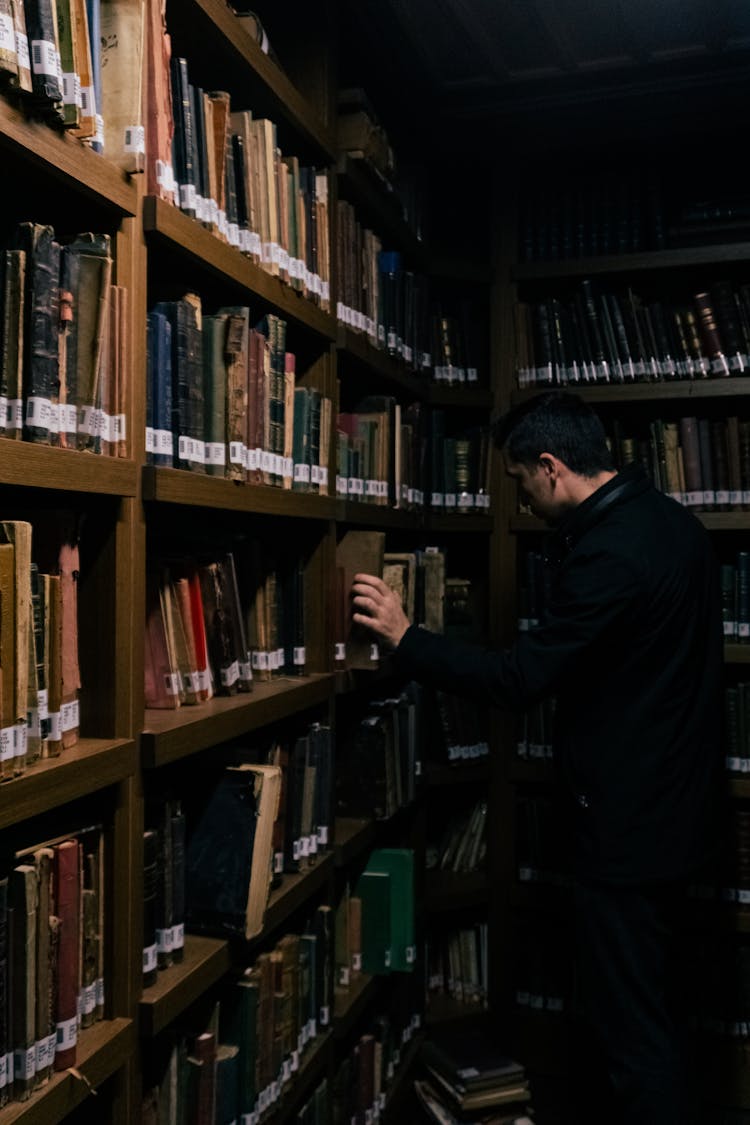 A Man Browsing At The Library