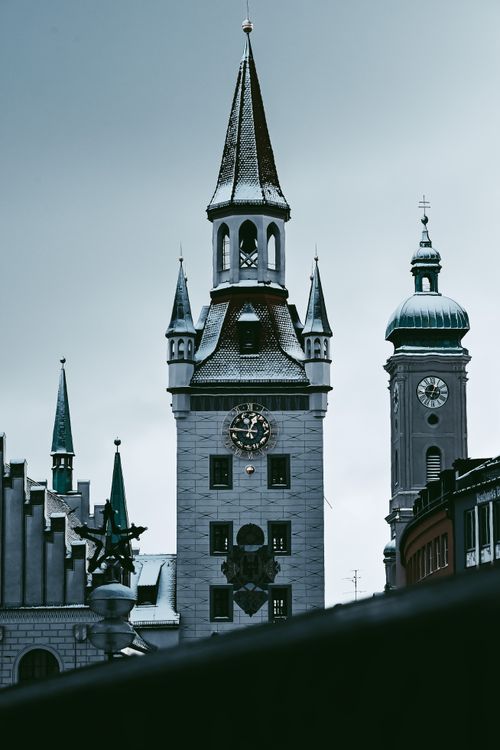 Free A classic Gothic clock tower in Munich's Old Town, showcasing historic architecture. Stock Photo