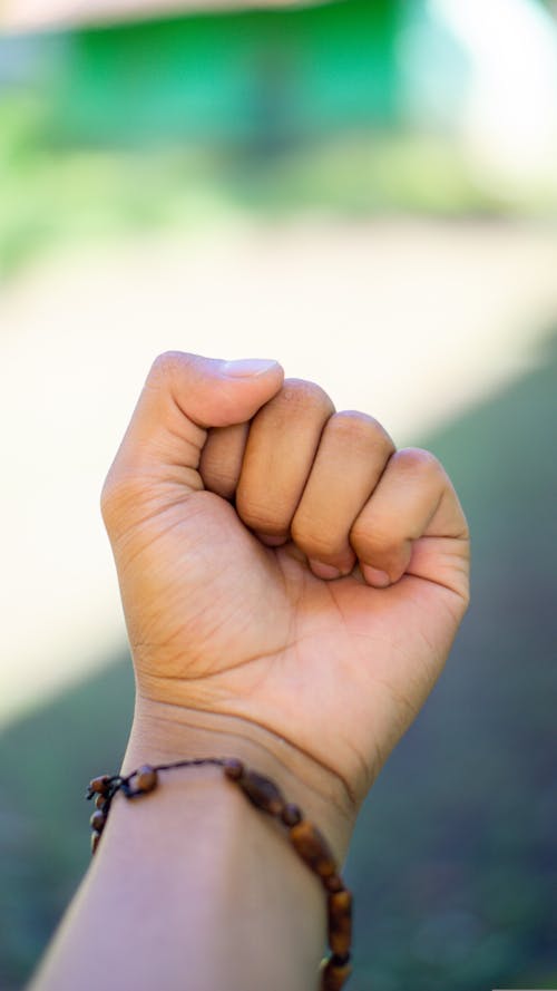 A Person Wearing Beaded Bracelet