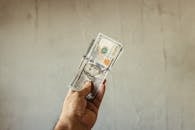 Man Holding Dollar Bills
