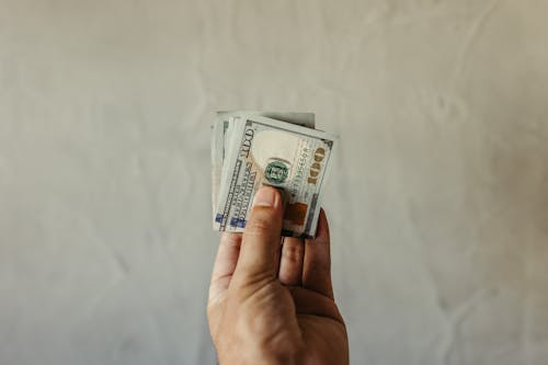 Kostnadsfri bild av dollar, finans, hand