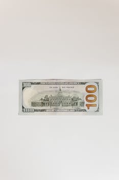 High-resolution image of a crisp US one hundred dollar bill with copy space.