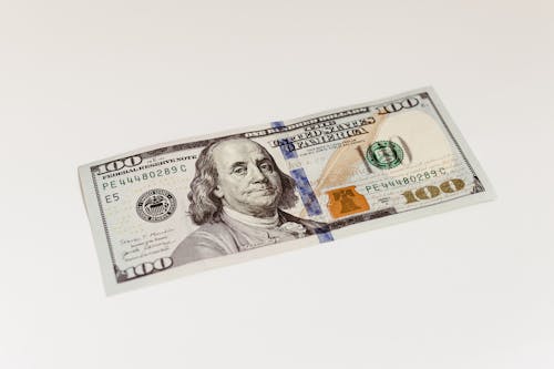 Безкоштовне стокове фото на тему «американський долар, банкнота, білої поверхні»