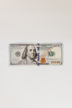 High-resolution image of a US 100 dollar bill, perfect for financial themes.