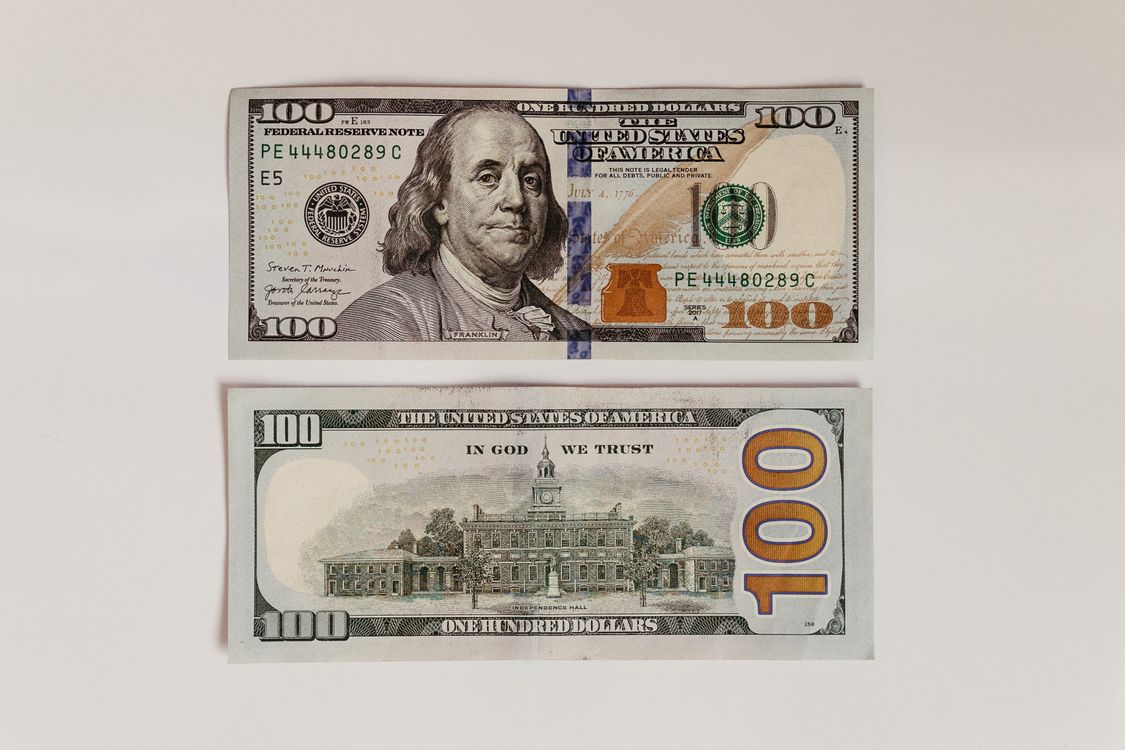Dollar File US Dollars Paper Money on a White Surface · Free Stock Photo