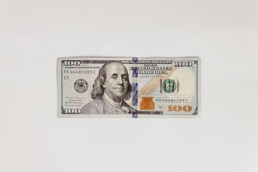 Detailed image of a US hundred dollar bill on a clean white background.