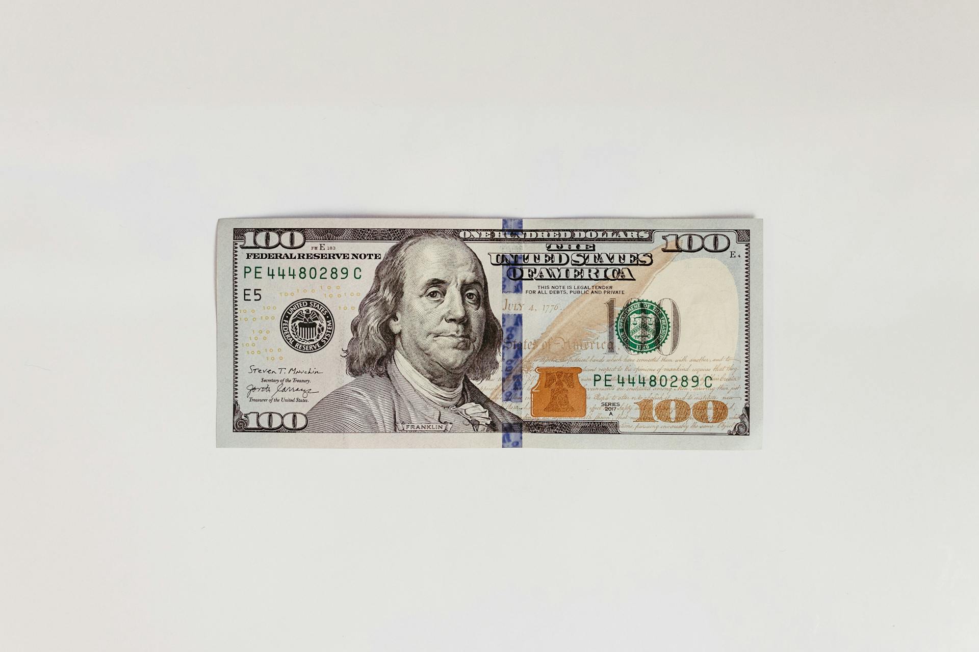 Detailed image of a US hundred dollar bill on a clean white background.