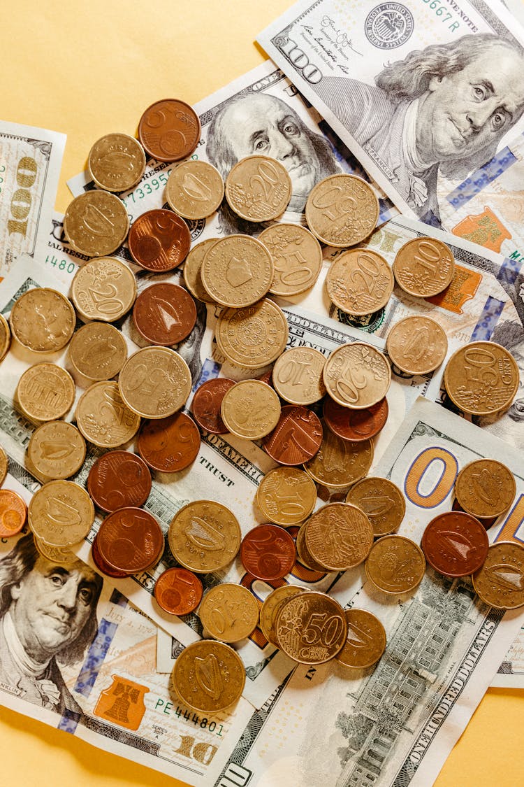 Close-Up Photo Of Dollar Money And Coins