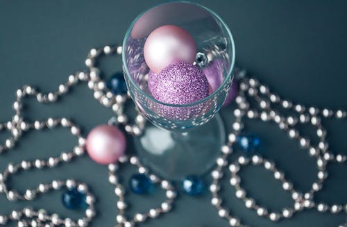 Wineglass with Pink Balls with a String of Beads at the Base