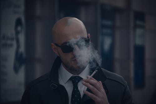 Free Close-up of a Man Smoking Cigarette Stock Photo