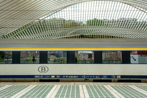 Free A sleek train at Liège-Guillemins Station in Belgium showcasing modern architectural design. Stock Photo