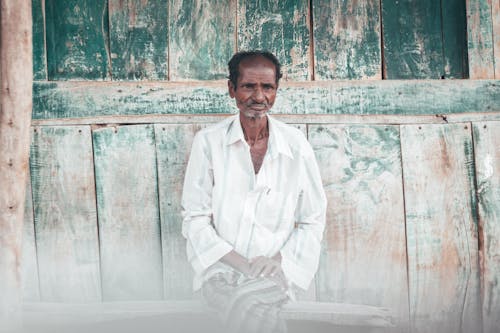 Man With Cross-legged Sitting on Bench