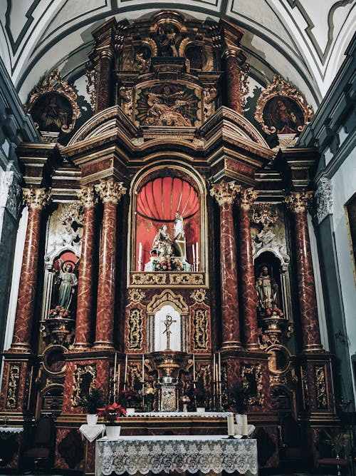 A Church Altar with Intricate Design Carvings and Statues