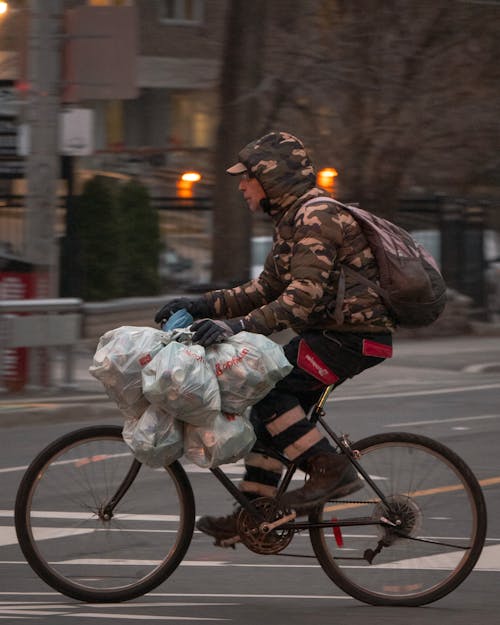 Man on a Bicycle on City Street