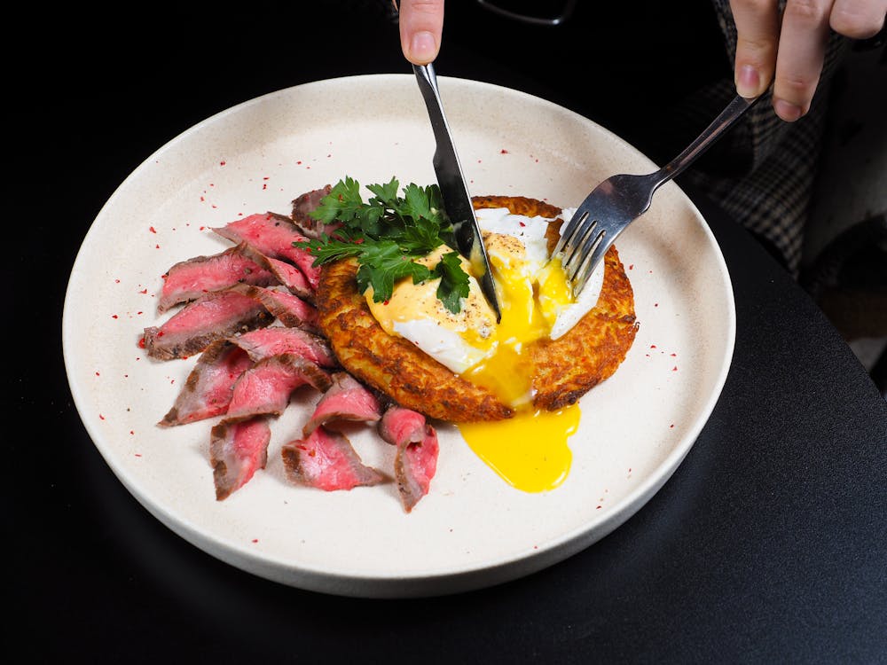 Free Person Cutting Food on a Plate  Stock Photo