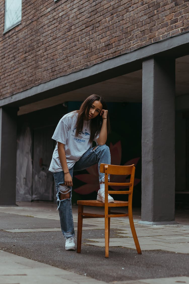 Casual Style Model Posing In Tshirt And Jeans