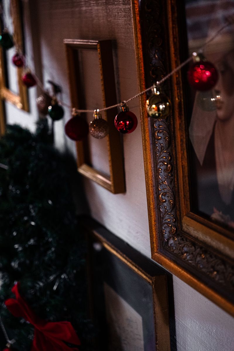 Close-up of Christmas decorations on a wall at a holiday party