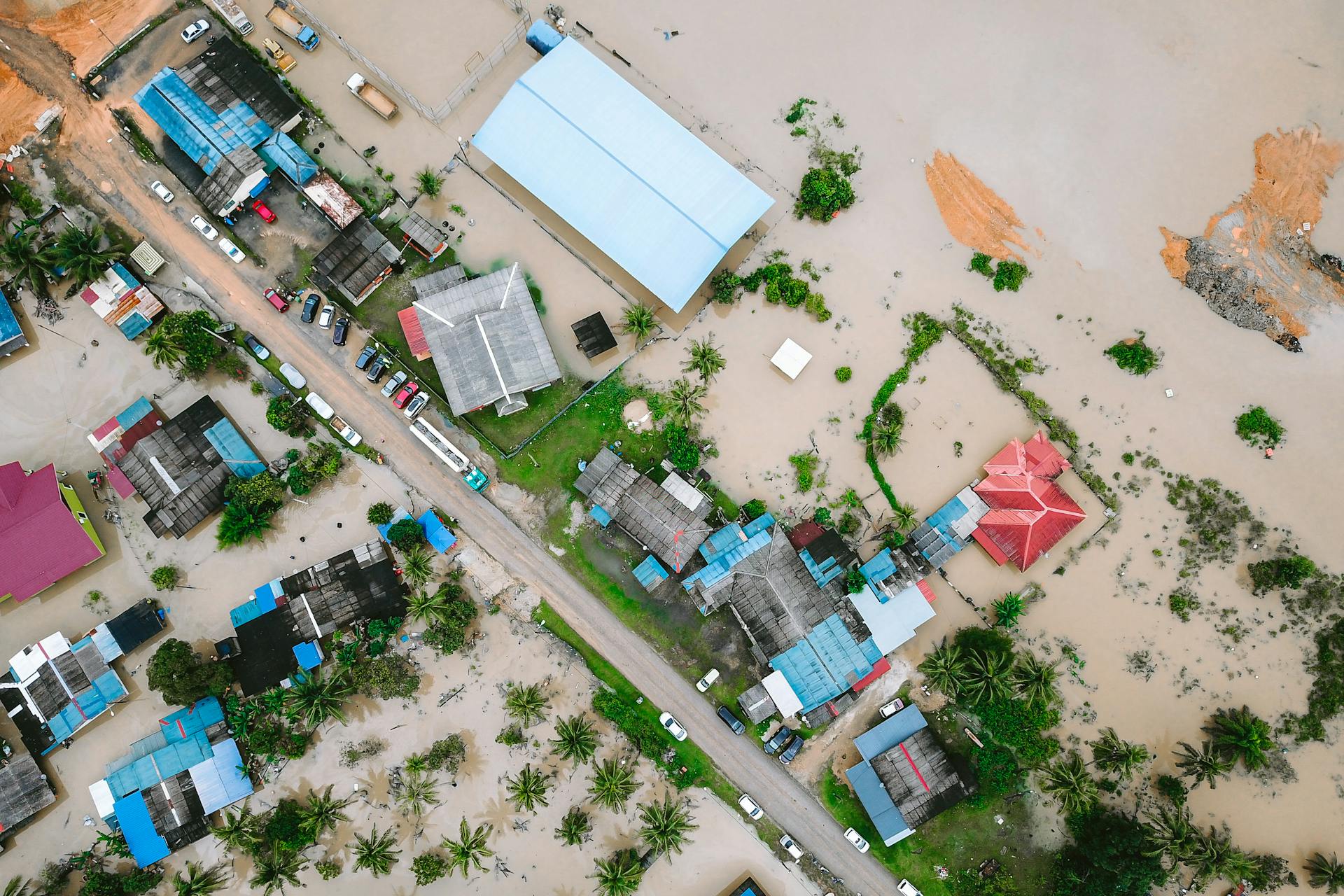 Aerial shot of a flooded town in Kijal, Terengganu, Malaysia, highlighting water damage.