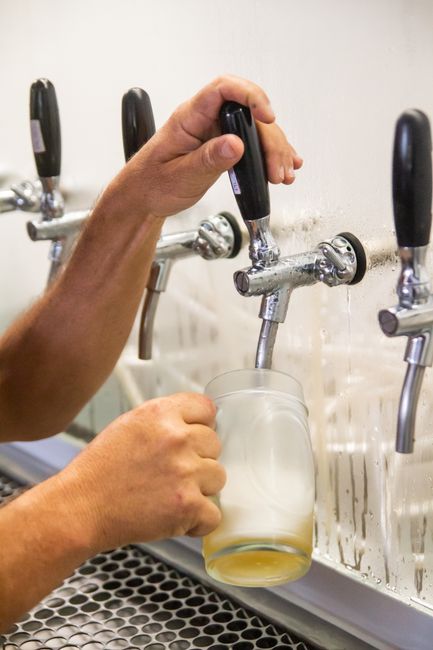 Beer taps lined up at a bar, the bit the drinker sees but does not control