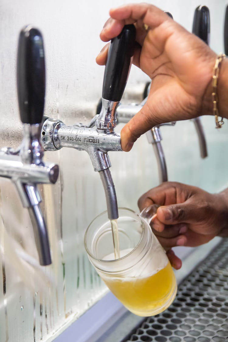 Man Pouring Beer From Tap