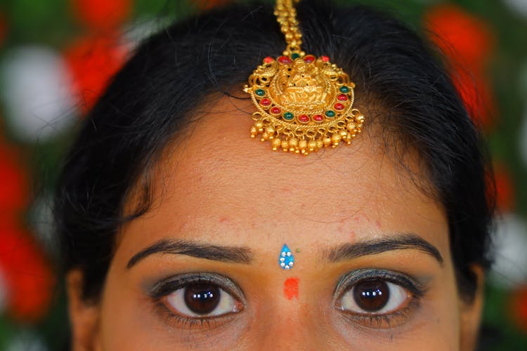 Woman Wearing A Gold Head Jewelry