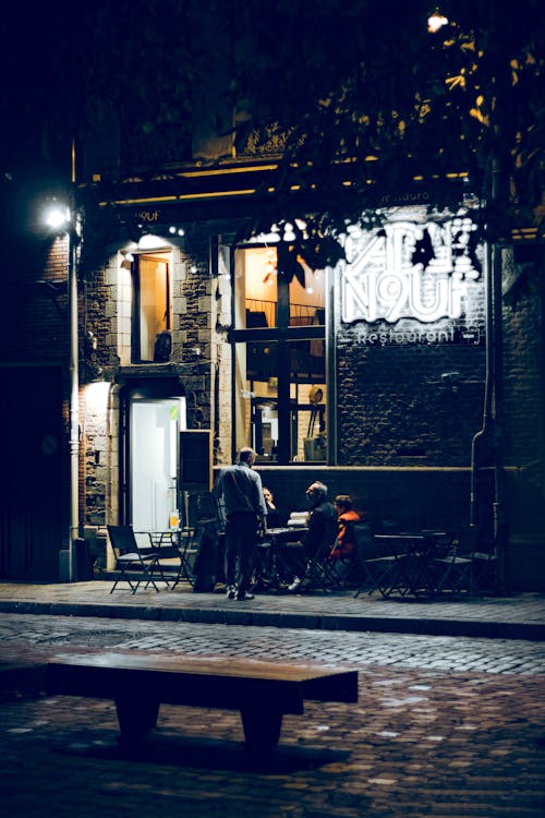 Customers in Front of the Restaurant Table N9uf in Lille at Night