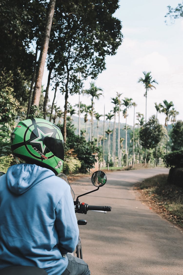 Man Riding A Motorcycle On The Road