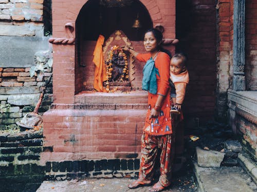 Mother with Son by Altar