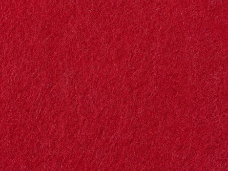 Close-up of a vibrant red textured fabric, offering rich color and depth.