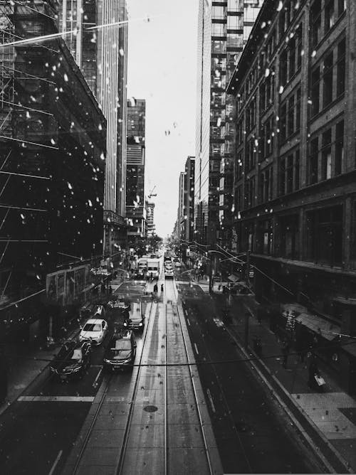 Black and White Picture of a Busy Street in City 