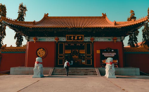 Person Walks Towards Temple