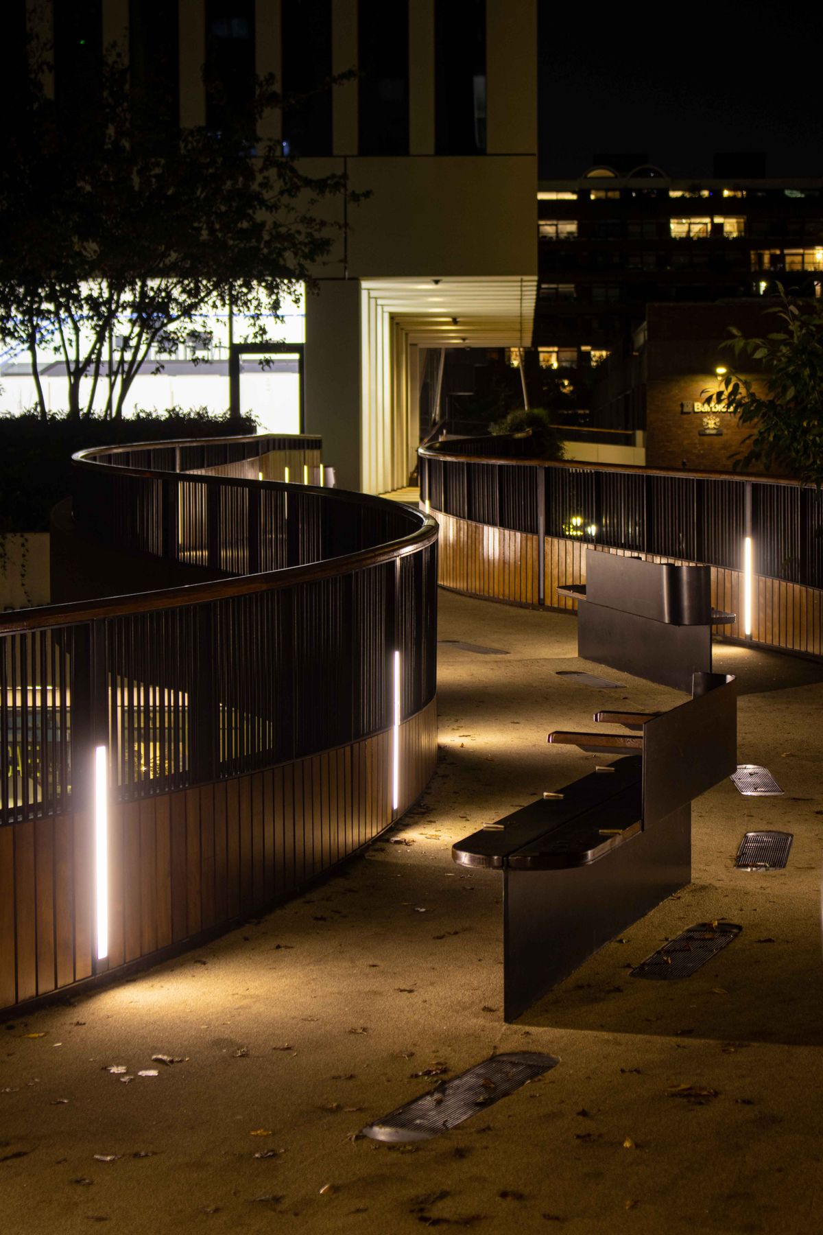 Outdoor pathway lights illuminating a walkway at night for landscape lighting