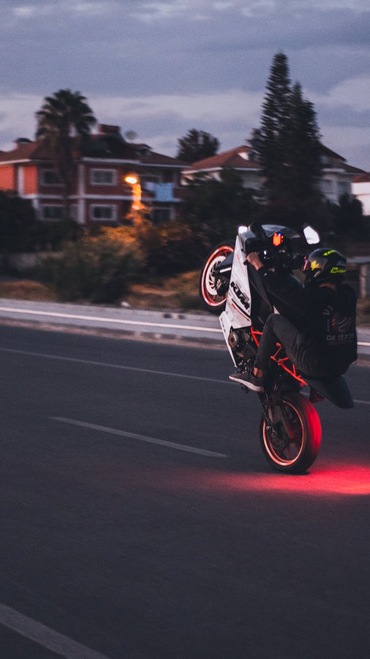 Person On A Motorcycle Doing A Wheelie