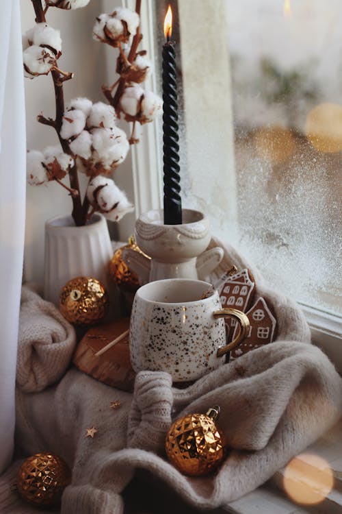 Winter Home Decor with Candle and Cotton Plant · Free Stock Photo
