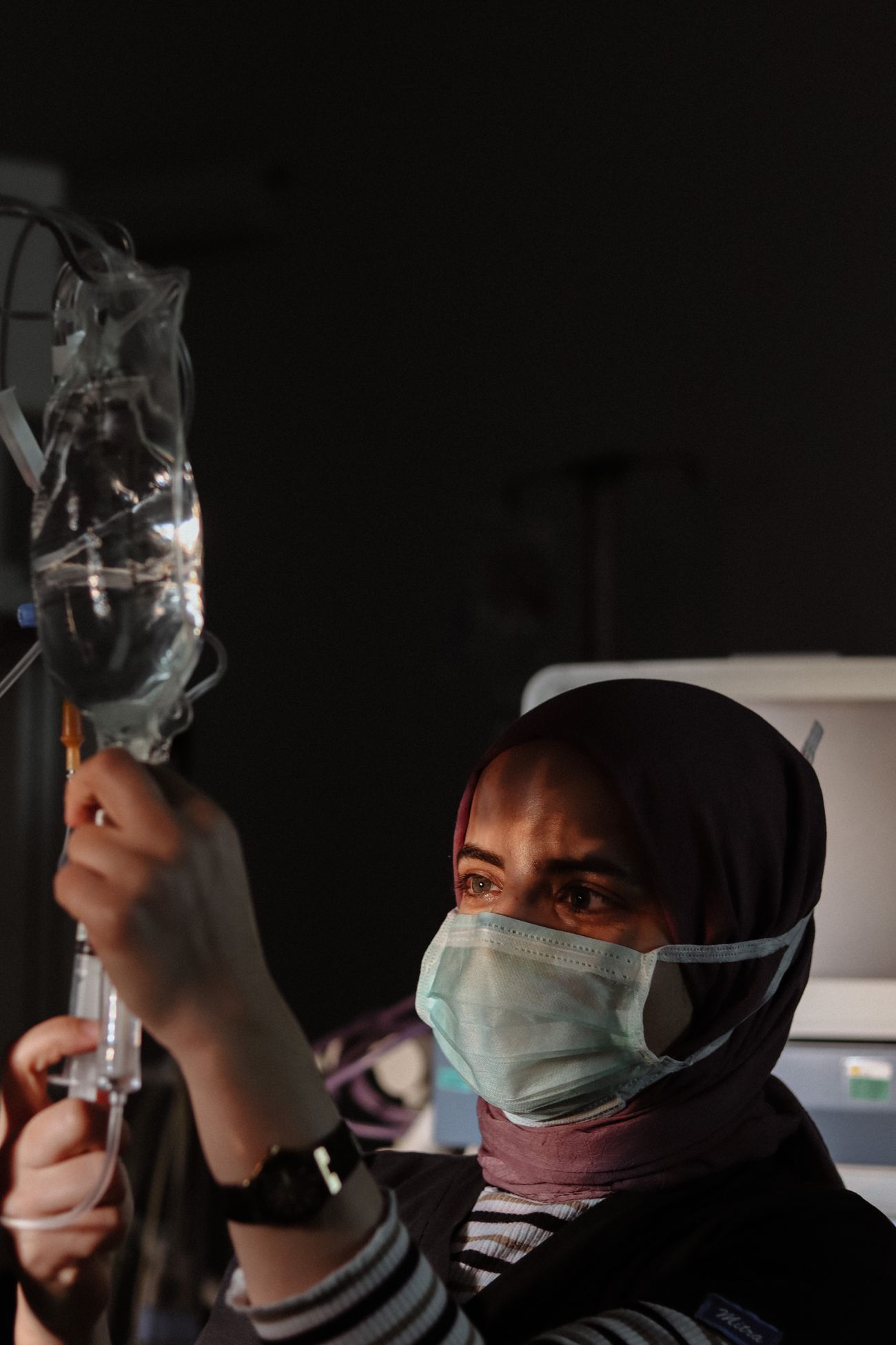 Healthcare worker preparing an IV drip
