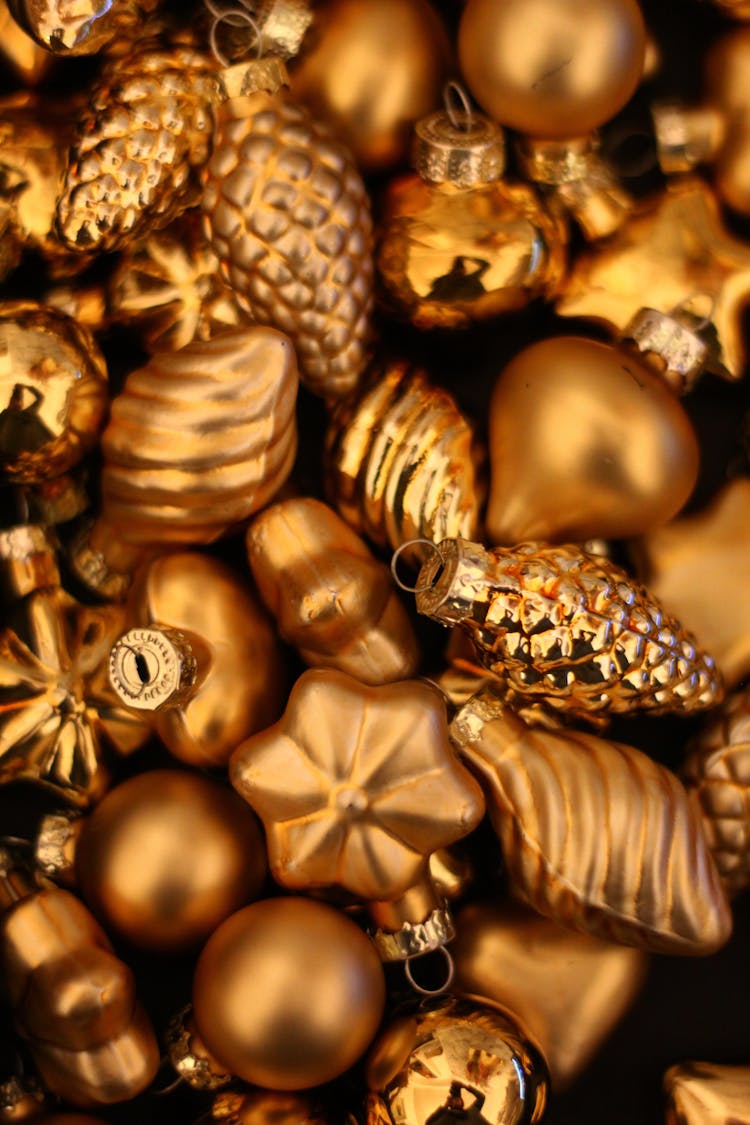 Pile Of Golden Christmas Ornaments